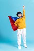 The image of a boy wearing a cape transforms into a hero photo