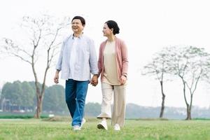 Elderly Asian couple in the park photo