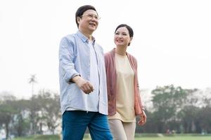 Elderly Asian couple in the park photo