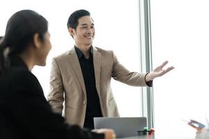 image of a group of Asian businessmen working together at the company photo