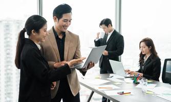 image of a group of Asian businessmen working together at the company photo