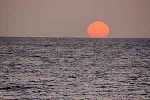 Sunset over the sea photo