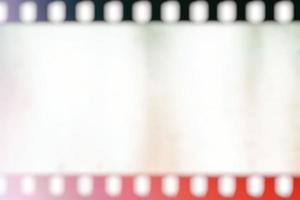 Blurred White Filmstrip Background with Red Light Leak. photo