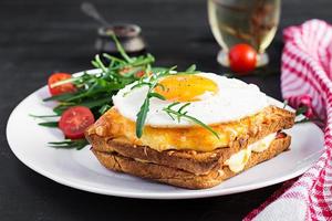 Breakfast. French cuisine. Croque madame sandwich close up on the table. photo