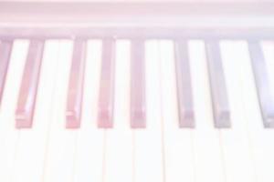 Blurred White Piano Keyboard Background, Suitable for Music Concept. photo