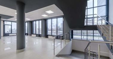 loop rotation and panoramic view in empty modern hall with columns, doors and panoramic windows. video