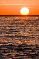 Sunset over the sea photo