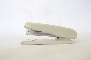 white stapler isolated on a white background. photo