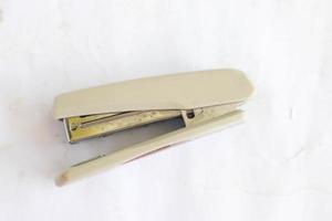 white stapler isolated on a white background. photo