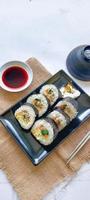 kimbap or gimbap is Korean roll Gimbap, kimbob made from steamed white rice bap and various other ingredients, this food from south korea photo