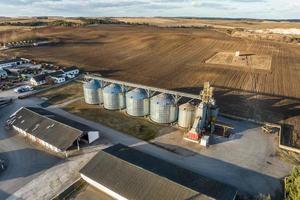 aerial view of agro-industrial complex with silos and grain drying line photo