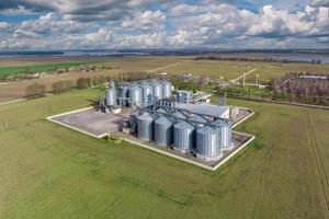 aerial view of agro-industrial complex with silos and grain drying line photo