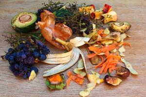 Domestic waste for compost from fruits and vegetables on the table. photo