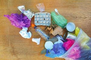 Garbage bag with different trash. Top view. Flat lay. photo