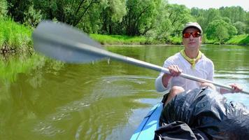 Family kayak trip. Father and daughter rowing boat on the river, a water hike, a summer adventure. Eco-friendly and extreme tourism, active and healthy lifestyle video