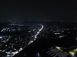 aerial view of office building and warehouse distribution center of retail based company at night. photo