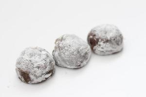 a close up of chocolate flavored mochi isolated on white background. photo