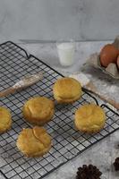 a traditional cake from Indonesia called kue sus filled with cream puffs. served on a cake rack. Food concept photo. photo