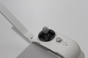 a close up of detailed white drone remote parts photo