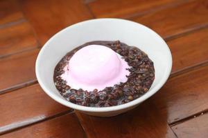 close up of a bowl of black sticky rice porridge photo