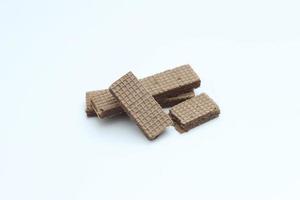 a close up of chocolate wafers isolated on white background. photo