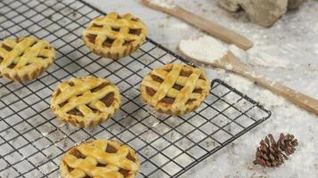 Small apple pie served on a cake rack, tastes sweet and savory. Food concept photo. photo