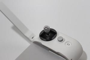 a close up of detailed white drone remote parts photo