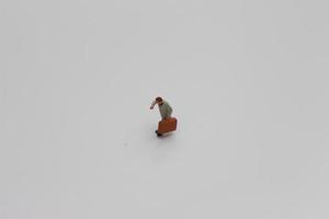 a close up of a miniature figure of an office worker photo