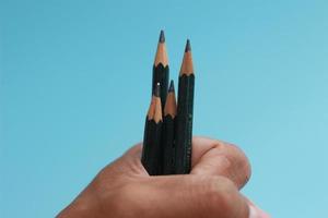 a close up of a bunch of pencils in hand photo