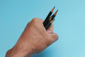 a close up of a bunch of pencils in hand photo