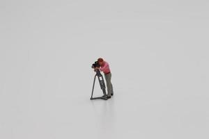 a close up of miniature figure of a videographer photo
