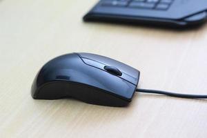 a photo of a black mouse and keyboard to work with. Technology equipment concept photo.