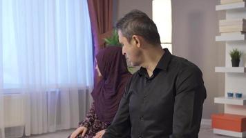 Religious Muslim couple praying in their home, worshiping Allah. Muslim Husband and wife pray at home and open their hands to pray to Allah. video