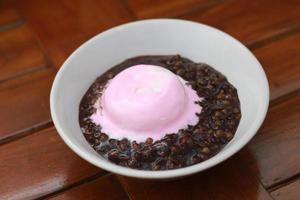 close up of a bowl of black sticky rice porridge photo