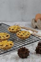 Small apple pie served on a cake rack, tastes sweet and savory. Food concept photo. photo