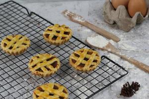 Small apple pie served on a cake rack, tastes sweet and savory. Food concept photo. photo