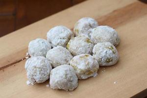 a close up of durian-flavored mochi served on a cutting board and ready to be eaten. photo