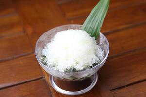 Es Kacang Merah or a cold drink made from red beans boiled with brown sugar served with coconut milk, shaved ice and covered with sweetened condensed milk chocolate and syrup. photo