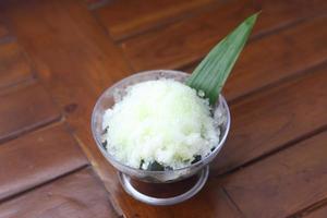 Es Kacang Merah or a cold drink made from red beans boiled with brown sugar served with coconut milk, shaved ice and covered with sweetened condensed milk chocolate and syrup. photo