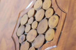 a close up of decorative detail on a wooden chair photo