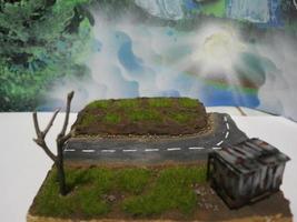 a close up of a diorama of a rice field scene and an old roadside house. miniature diorama photo concept.
