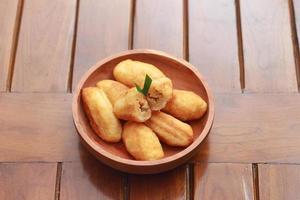 Comro or combro, a traditional Javanese snack made of deep fried grated cassava filled with a savory mix of oncom or fermented soy bean cake and chili photo