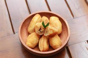 Comro or combro, a traditional Javanese snack made of deep fried grated cassava filled with a savory mix of oncom or fermented soy bean cake and chili photo