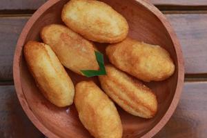 Comro or combro, a traditional Javanese snack made of deep fried grated cassava filled with a savory mix of oncom or fermented soy bean cake and chili photo