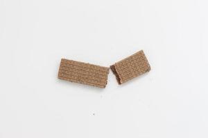 a close up of chocolate wafers isolated on white background. photo