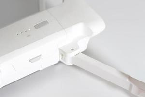 a close up of detailed white drone parts photo