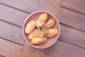 Comro or combro, a traditional Javanese snack made of deep fried grated cassava filled with a savory mix of oncom or fermented soy bean cake and chili photo