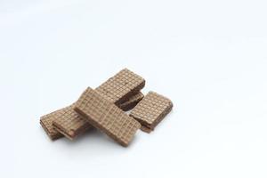 a close up of chocolate wafers isolated on white background. photo