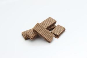 a close up of chocolate wafers isolated on white background. photo