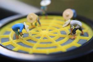 photo of a miniature figure with the concept of a farmer farming on a respirator.